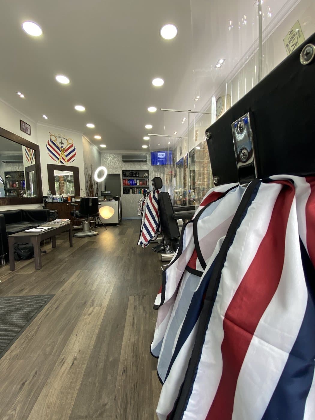 The length of the shop floor, chairs waiting